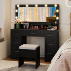 Vanity Desk with Mirror and Lights in a chic bedroom setting, featuring a stool and illuminated mirror.